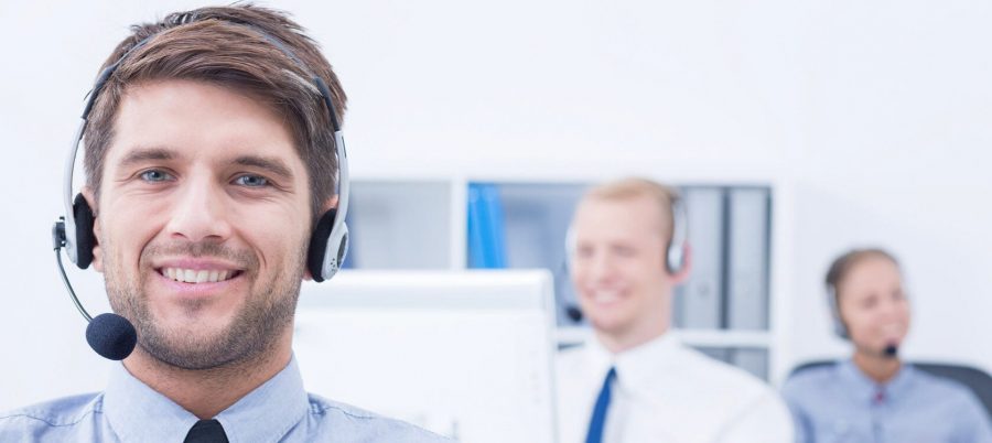 Guy in call center with head set in place