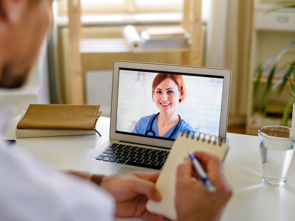 Man receiving Telehealth advice from a doctor via video